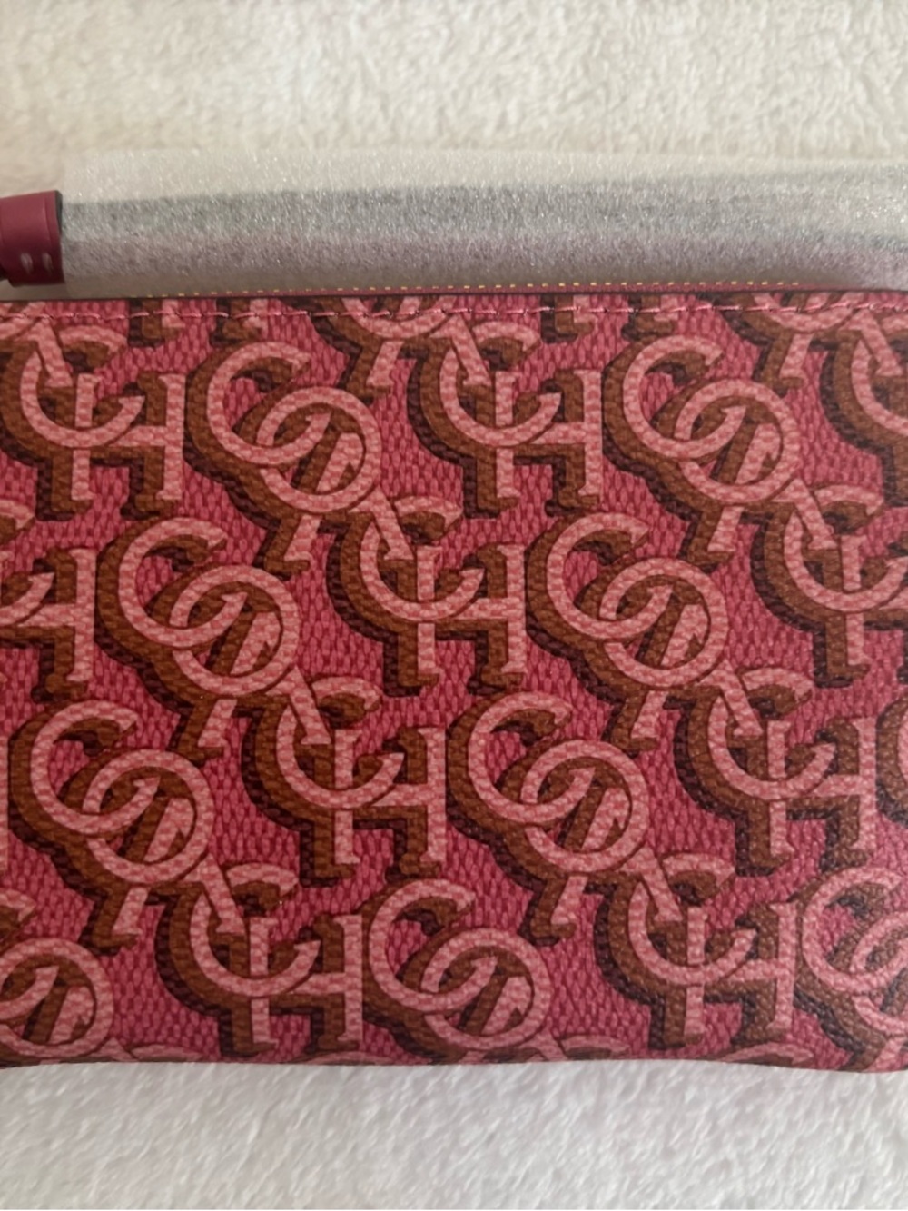Coach monogram rouge corner zip wristlet
